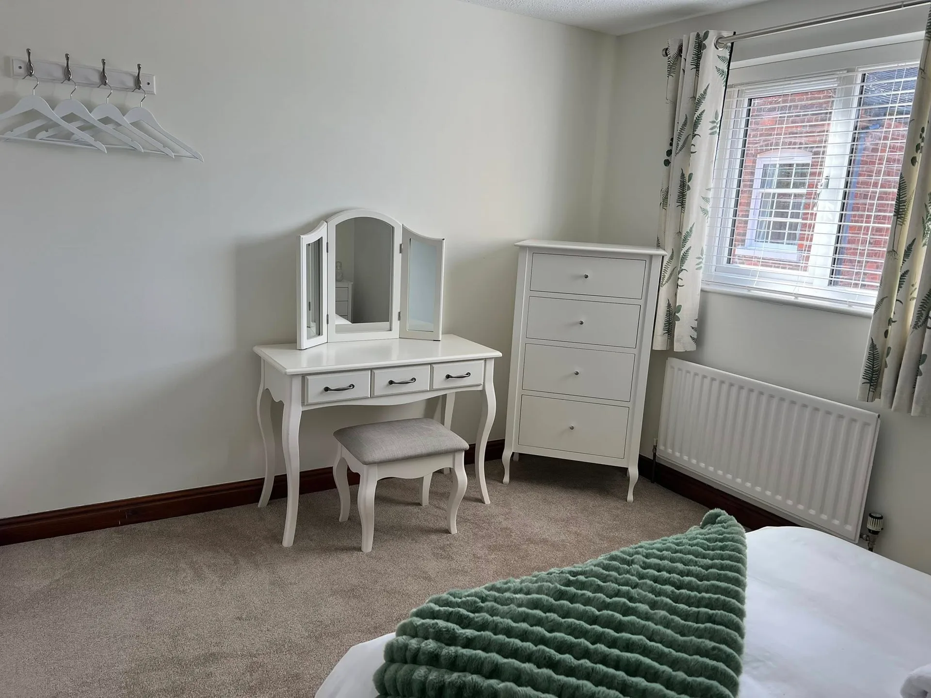 Beautifully dressed bedroom at Bowling Green Cottage